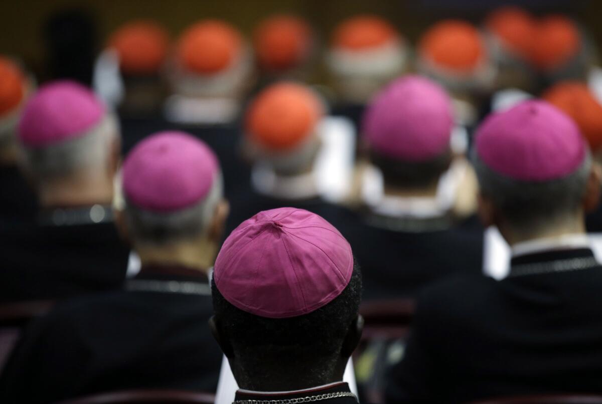 Bishops and cardinals attend a morning session of a two-week synod on family issues at the Vatican on Monday.