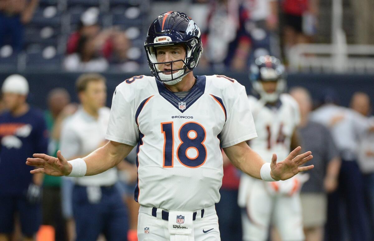 Denver's Peyton Manning warms up before a preseason game against Houston on Aug. 22.