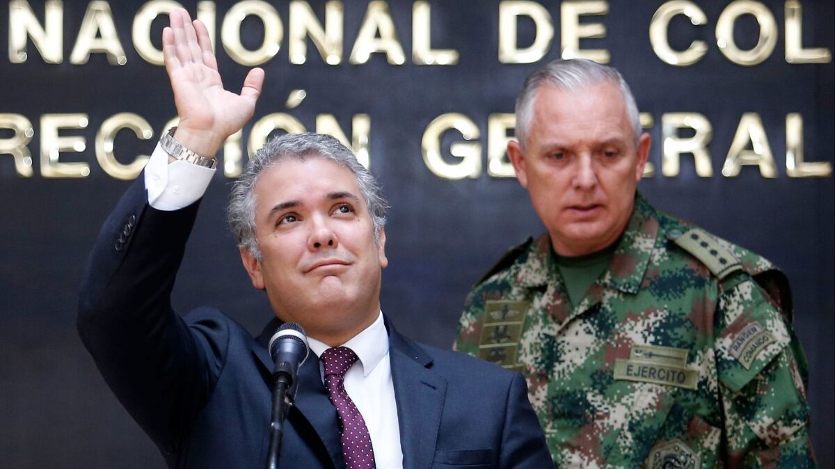 Colombian President Ivan Duque, left, and Gen. Alberto Mejia, general commander of Colombian military forces, on Sept. 19, 2018.