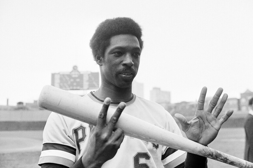 FILE - Pittsburgh Pirates' Rennie Stennett flashes seven fingers, one for each hit he made in the Pittsburgh Pirates' 22-0 win over the Chicago Cubs in Chicago, in this Tuesday, Sept. 16, 1975, file photo. Rennie Stennett has died. He was 72. The team, citing information provided by the Stennett family, said Stennett passed away early Tuesday morning, May 18, 2021, following a bout with cancer. (AP Photo/Charles E. Knoblock, File)