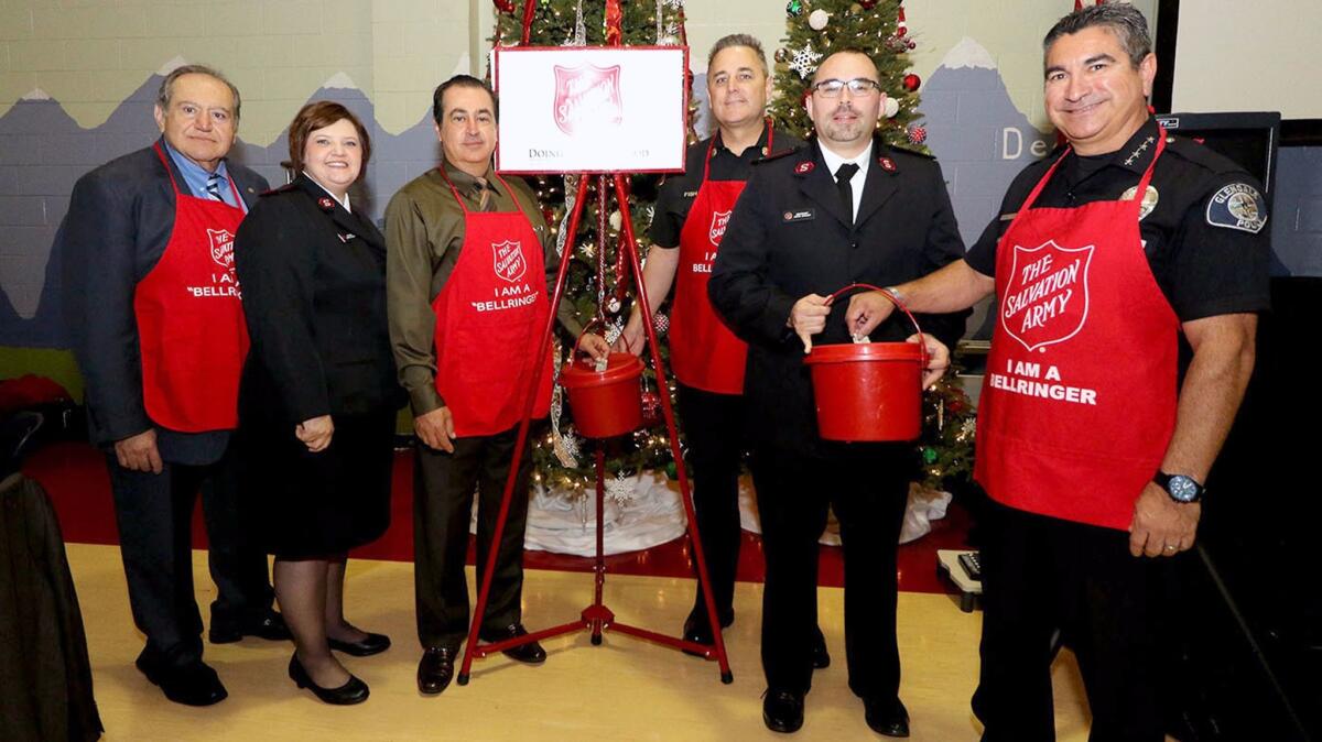 Glendale city officials and Salvation Army members at the kickoff of the Glendale Salvation Army's Red Kettle Drive on Friday.