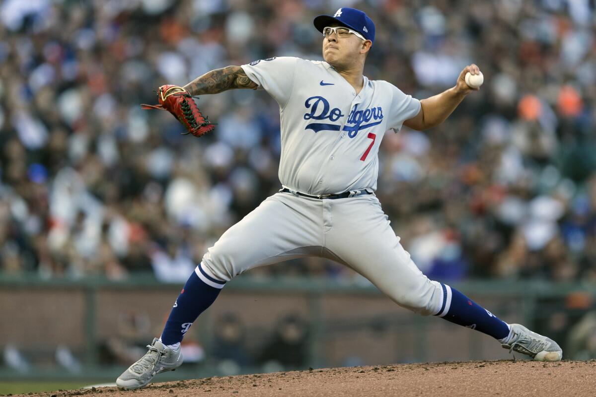 Los Angeles Dodgers starting pitcher Julio Urias works against the San Francisco Giants in the first inning of a baseball game in San Francisco, Saturday, Sept. 4, 2021. (AP Photo/John Hefti)