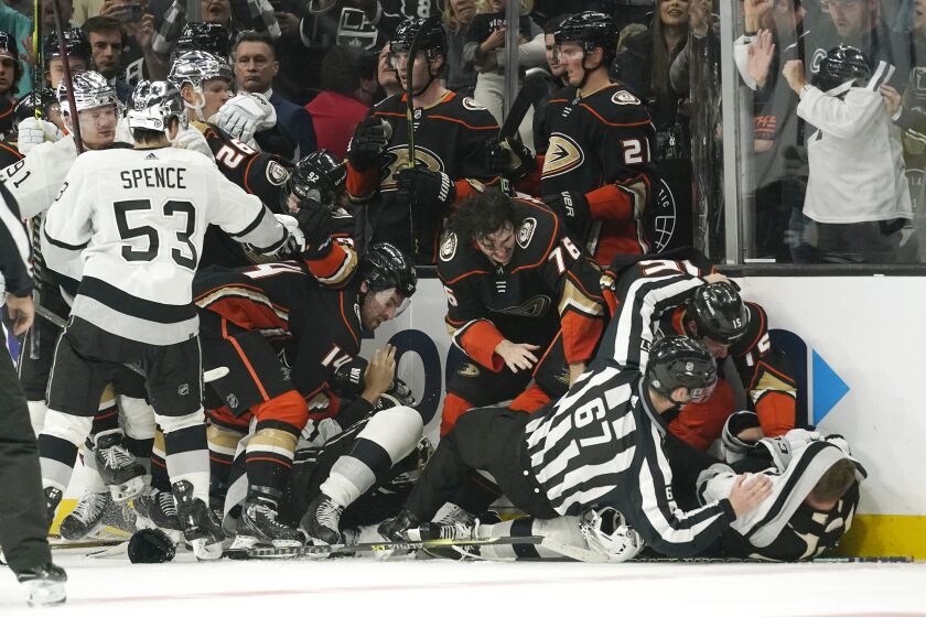 Members of the Los Angeles Kings and Anaheim Ducks scuffle during the third period of an NHL hockey game Saturday, April 23, 2022, in Los Angeles. (AP Photo/Mark J. Terrill)