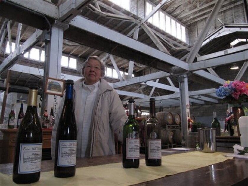 In this photo taken April 14, 2011, JoAnn Stear poses at Eaton Hill Winery near Granger, Wash. Stear is among several of Washington state's founding winemakers looking to retire. (AP Photo/Shannon Dininny)