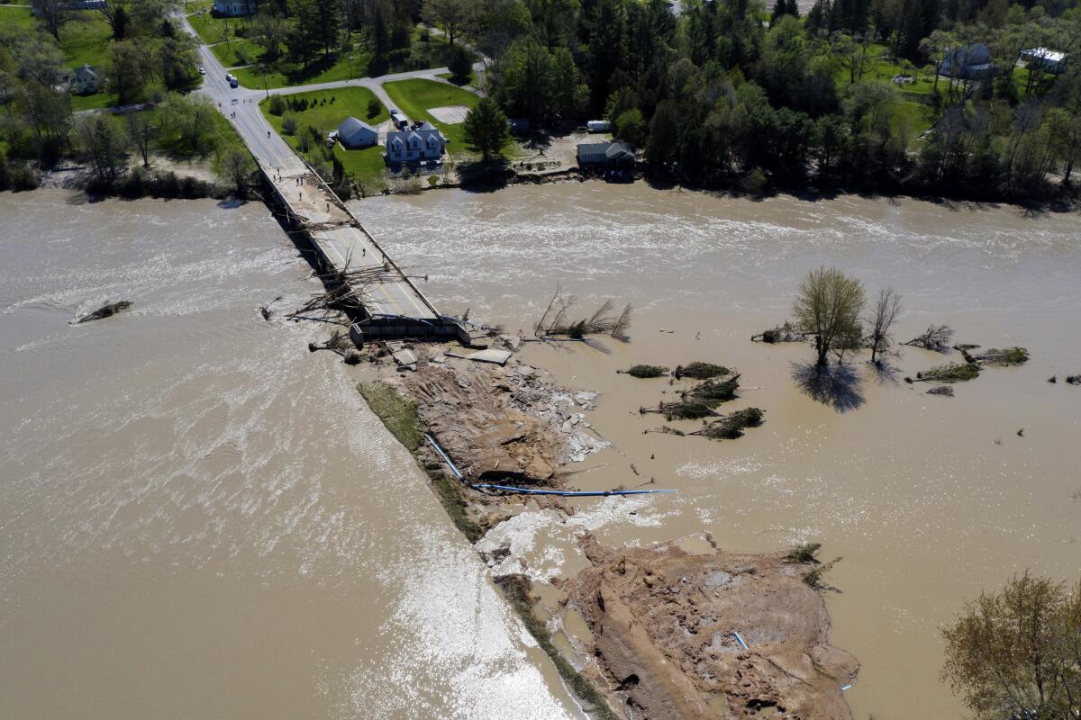 People survey flood damage