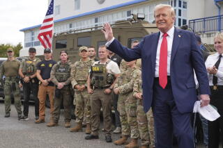 President Trump with members of law enforcement and National Guard troops in Washington.