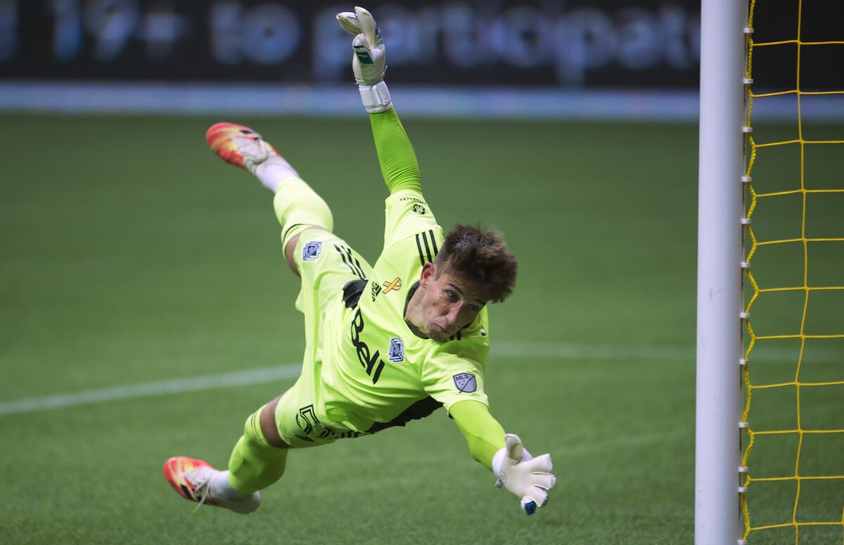 Vancouver Whitecaps goalkeeper Thomas Hasal (51) makes a save against the Montreal Impact during the first half of an MLS soccer game, Sunday, Sept. 13, 2020, in Vancouver, British Columbia. (Jonathan Hayward/The Canadian Press via AP)