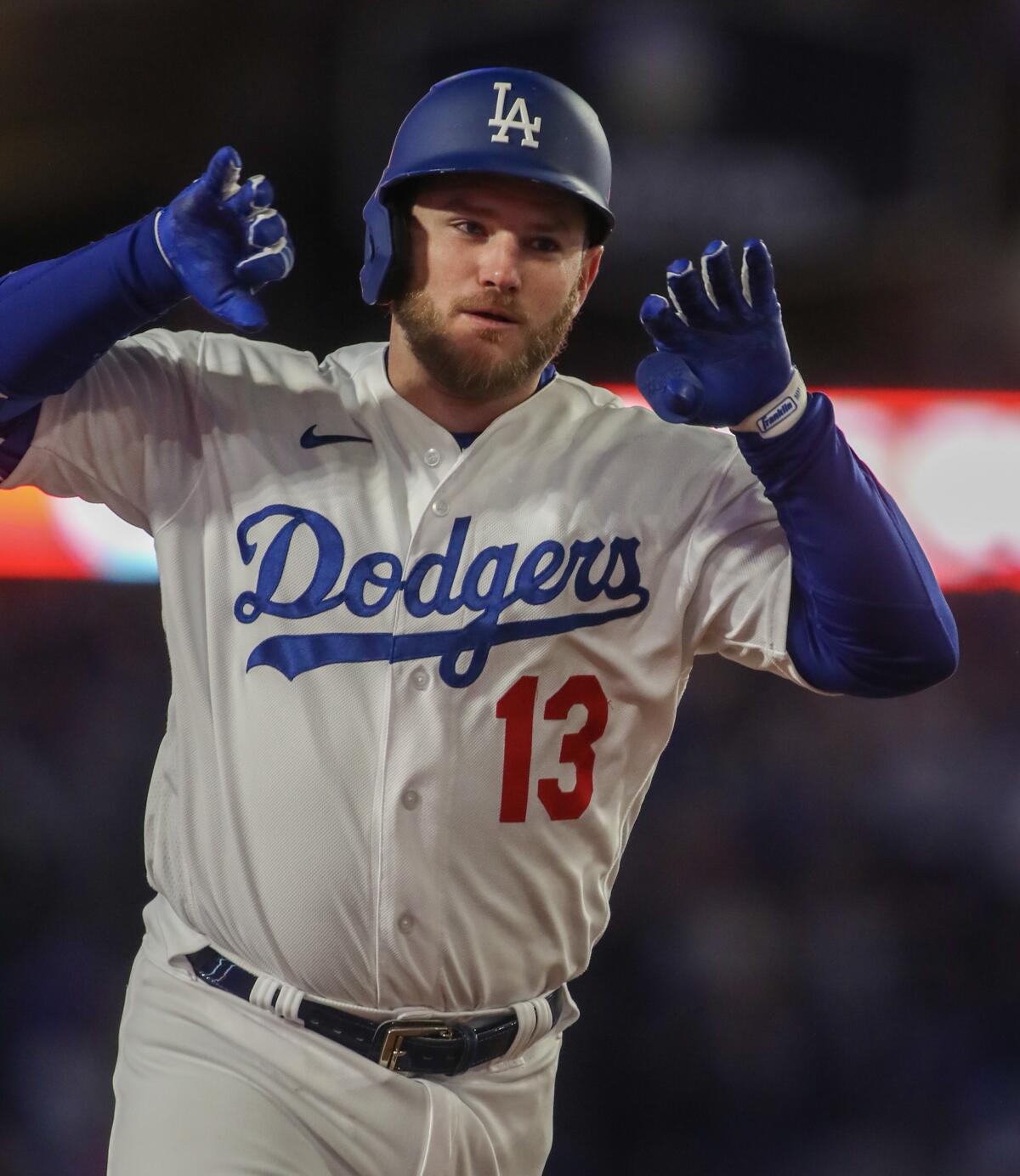 Max Muncy celebrates after hitting a solo home run in the seventh inning.