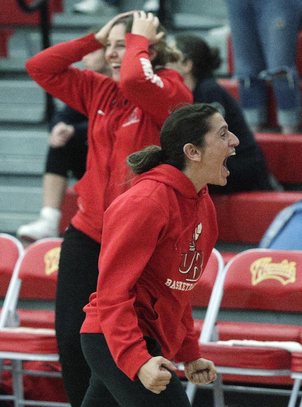 Burroughs' head coach Vicky Oganyan gives a huge yell for victory after a tense conclusion to a tough game with Whittier Christian in the CIF Southern Section Division II-A girls' basketball quarterfinal at Whittier Christian High School in La Habra on Wednesday, February 19, 2020. Burroughs won the game 41-39, a game that was hard fought until the last points were scored