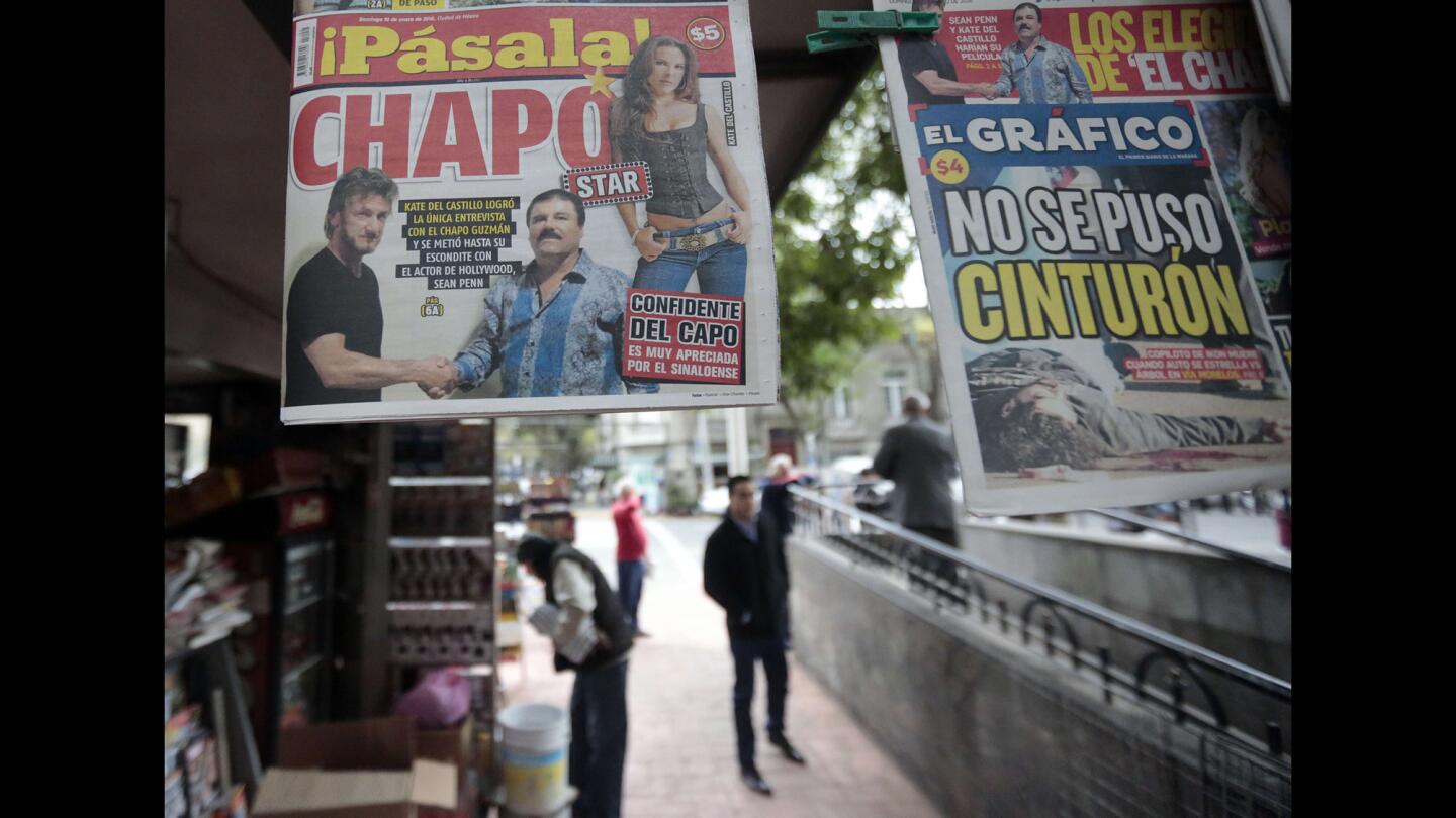 A newspaper shows a picture of drug lord Joaquin Guzman, aka "El Chapo," shaking hands with actor Sean Penn, left, as seen at a newsstand in Mexico City on Sunday.