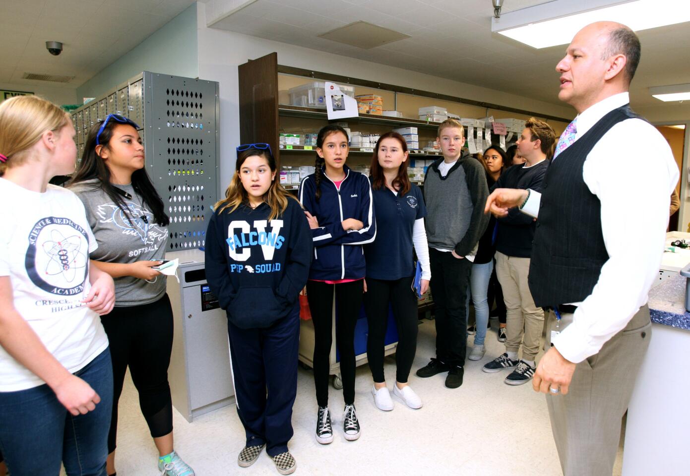 Glendale Adventist Medical Center's director of pharmaceutical services Romic Eskandarian, Pharm.D., explains what his department does in comparison to what a general pharmacy can provide, during a visit by the Crescenta Valley High School's Science and Medicine Academy to the hospital in Glendale on Thursday, Feb. 2, 2017. Forty-three students from freshmen to seniors participated in tour of the hospital.