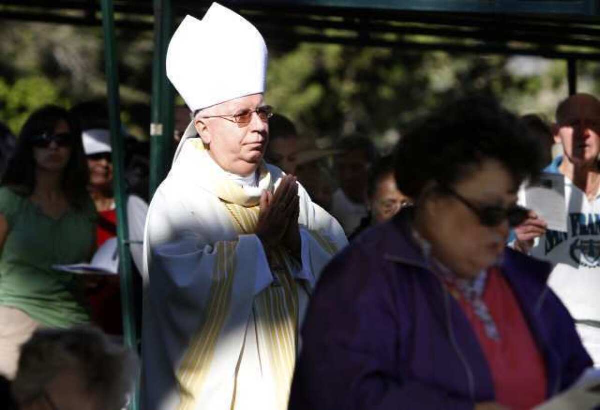 Cirilo Flores, while auxiliary bishop of Orange, walks down the aisle during an All Souls Day Mass in 2010. Now bishop of the San Diego diocese, he has been hospitalized since April 16 after suffering a stroke.