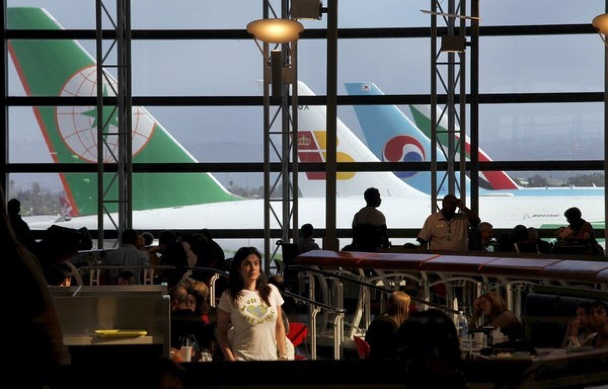 Planes from around the world line up at LAX's Tom Bradley International Terminal. The terminal's food court is a good hangout spot for long layovers. It has the nicest views, most food choices and comfy seating.