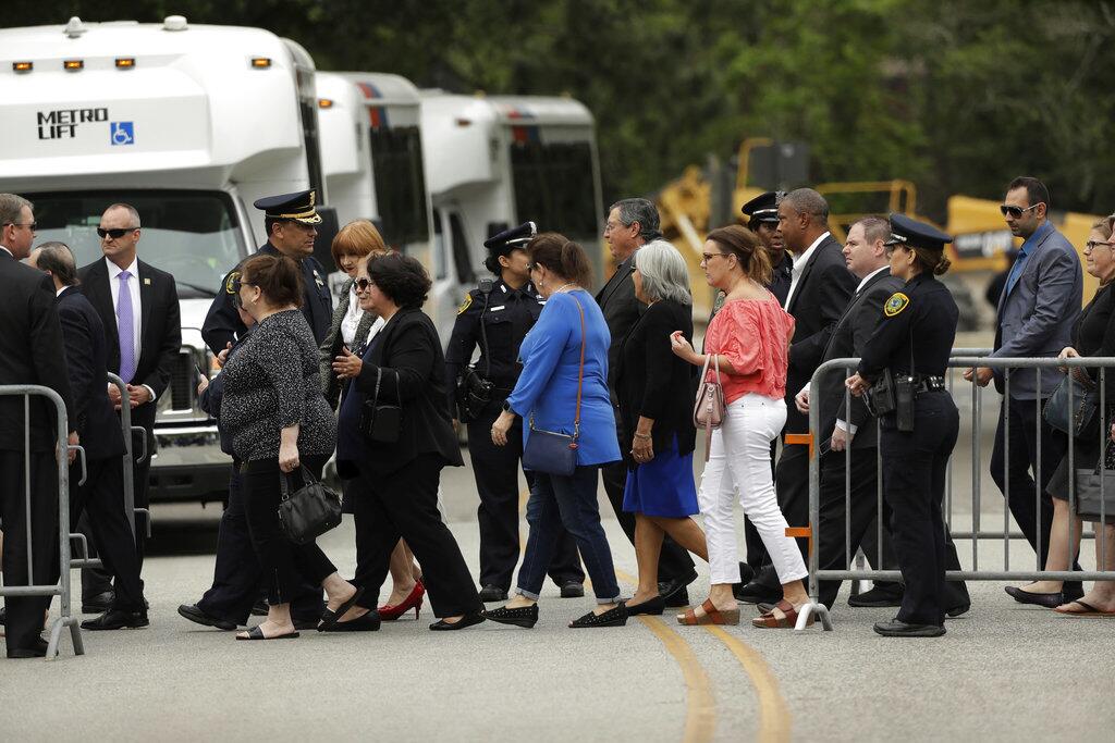 People arrive at St. Martin's Episcopal Church for the visitation of former first lady Barbara Bush Friday, April 20, 2018, in Houston.