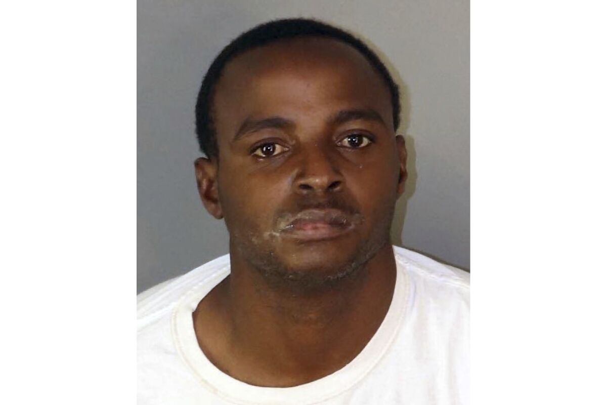 This undated photo provided by the Riverside Police Department shows Kevin Errol Lewis. Lewis has been arrested on suspicion of murder after he allegedly pushed a woman in front of a moving train in Southern California, authorities said Thursday, April 14, 2022. (Riverside Police Department via AP)