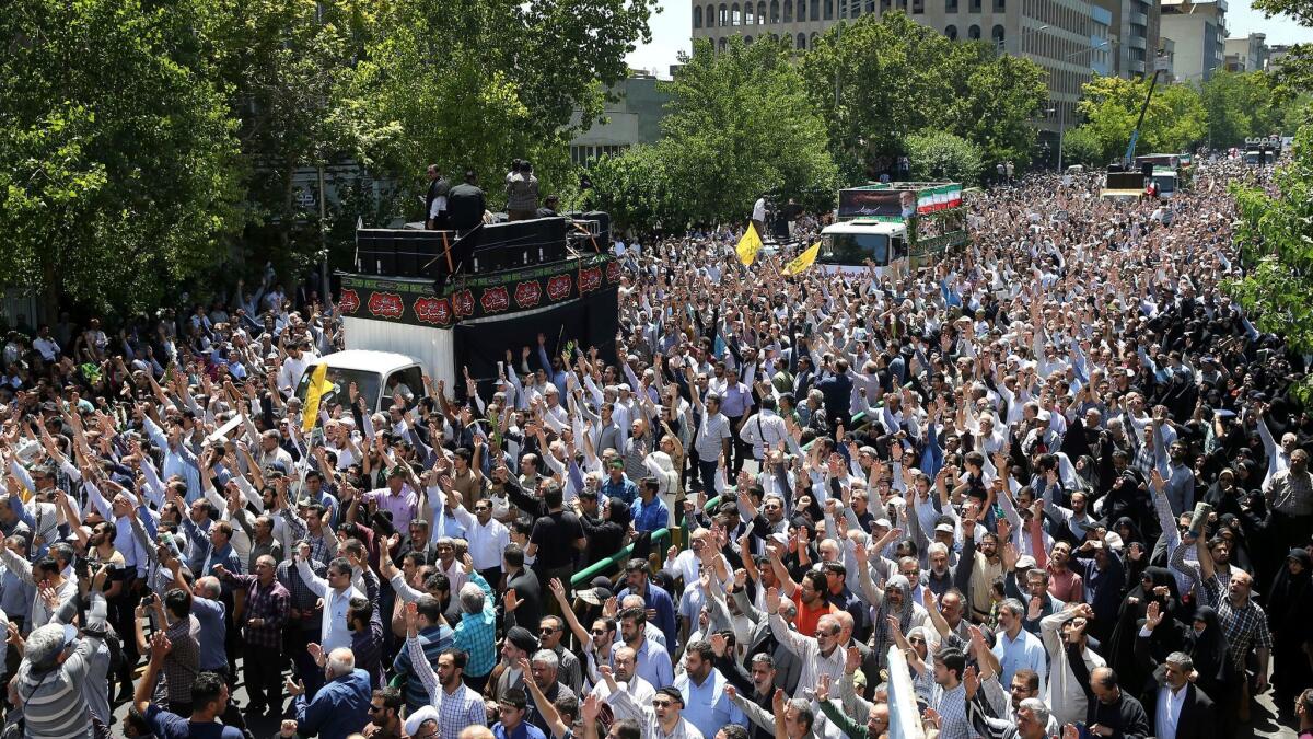 Iranians on Friday fill the streets of Tehran for a funeral for victims of Wednesday's Islamic State militant attacks.