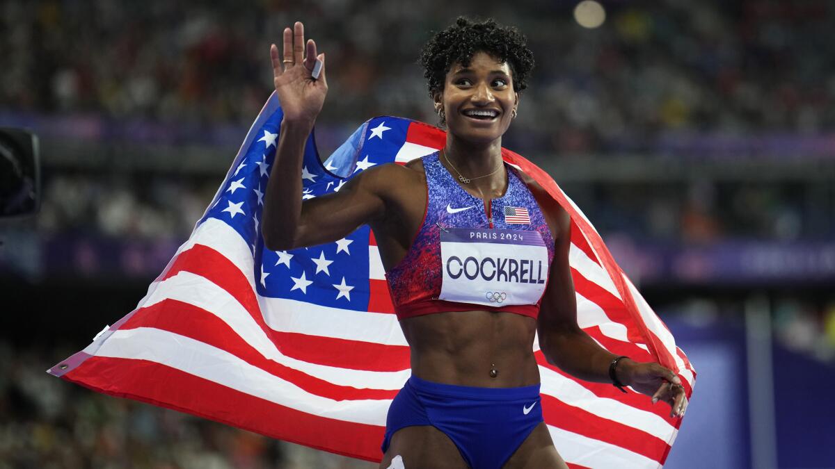 U.S. athlete Anna Cockrell celebrates after winning the silver medal in the women’s 400-meter hurdles at the Paris Olympics.