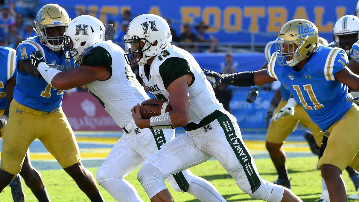 Hawaii running back Cole Brownholtz heads toward the end zone against UCLA for a score in the fourth quarter.