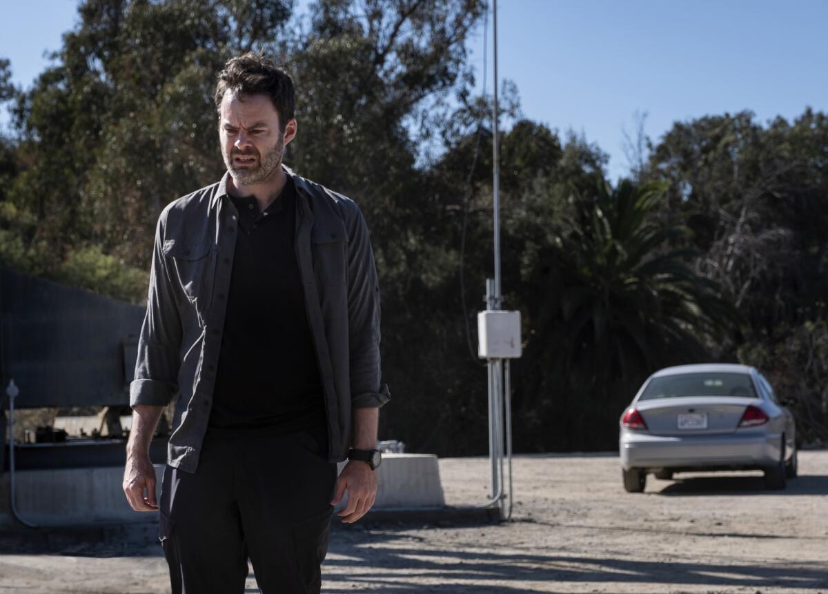 Bill Hader walks away from a car in a scene from "Barry." 