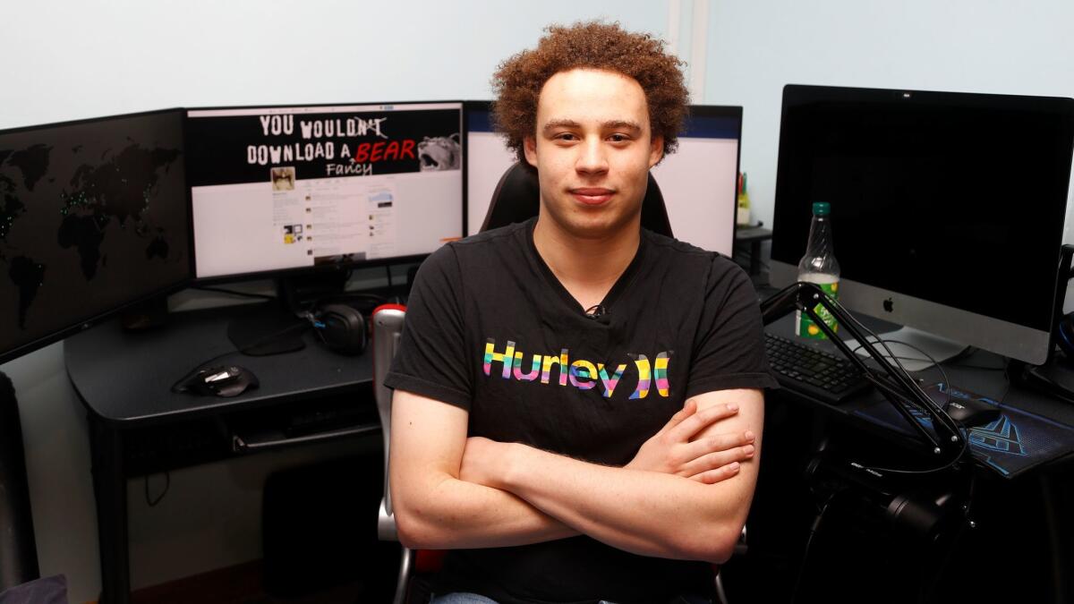 British IT expert Marcus Hutchis, who has been branded a hero for slowing down the "WannaCry" global cyberattack, at his workstation during an interview in Ilfracombe, England, Monday, May 15, 2017.