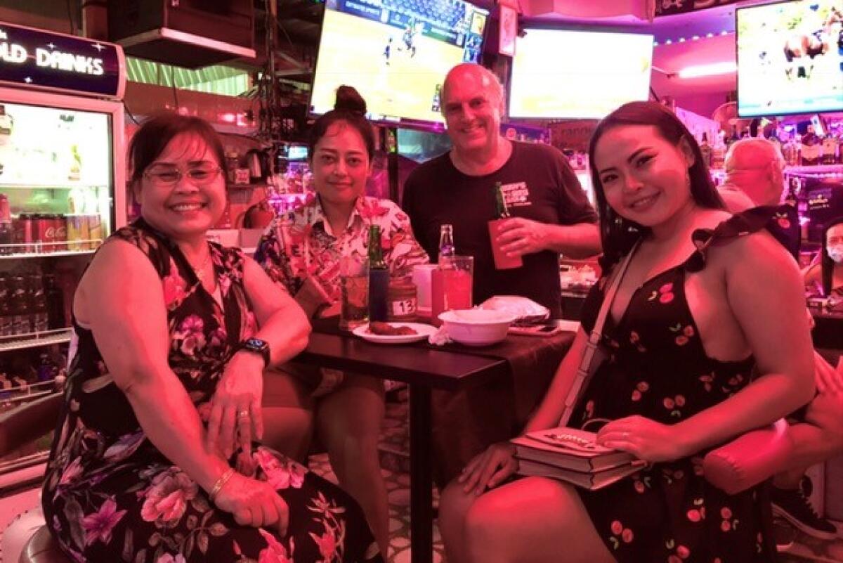 Former sportswriter Danny Knobler with his family at his sports bar, Danny's Sports Bar, in Pattaya, Thailand.
