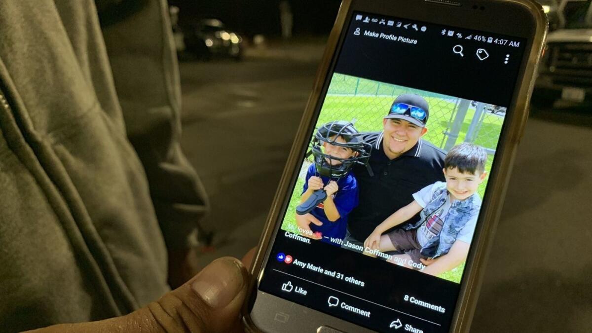 Jason Coffman shows a photo of his son, Cody, middle.