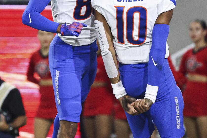 Boise State wide receiver Eric McAlister (80) and quarterback Taylen Green (10) celebrate a touchdown against San Diego State during an NCAA college football game Friday, Sept. 22, 2023, in San Diego. (Meg McLaughlin/The San Diego Union-Tribune via AP)