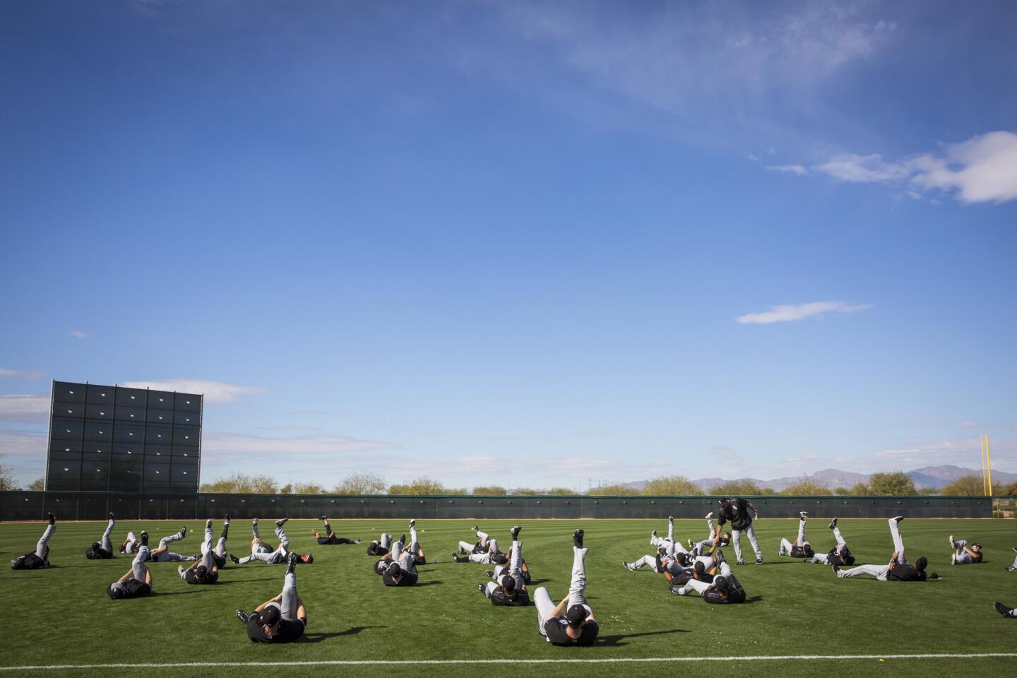 Players stretch at practice.