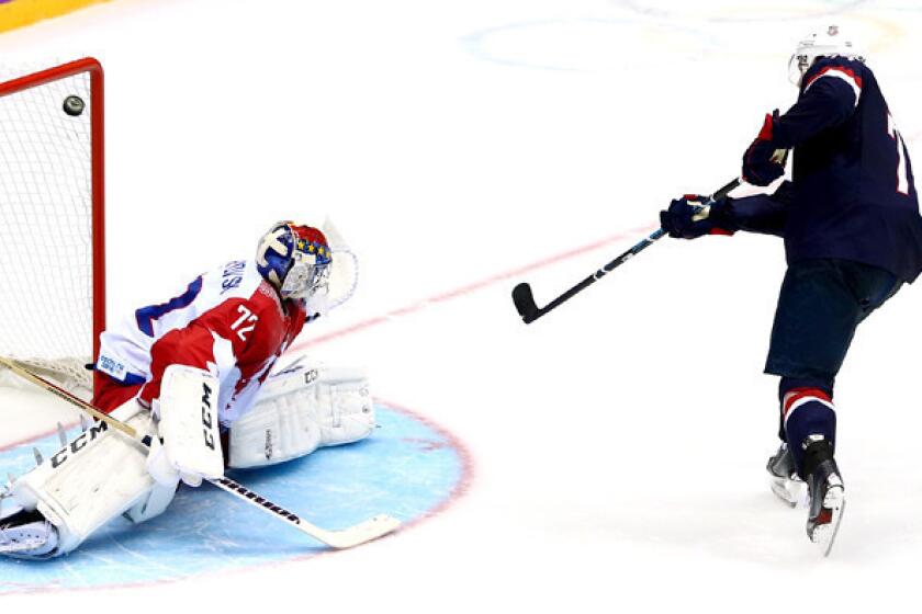 U.S. forward T.J. Oshie beats Russia goaltender Sergei Bobrovski during the shootout in a preliminary-round game at the Sochi Olympics on Saturday.