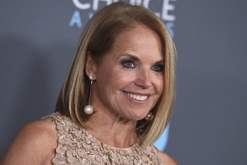 FILE - In this Jan. 11, 2018 file photo, Katie Couric poses in the press room at the 23rd annual Critics' Choice Awards in Santa Monica, Calif. Couric is writing a memoir, one she is counting on to live up to its title: "Unexpected." In an announcement Tuesday, Feb. 12, 2019, the publisher Little, Brown and Company told The Associated Press that the book was scheduled for spring 2021. (Photo by Jordan Strauss/Invision/AP, File)