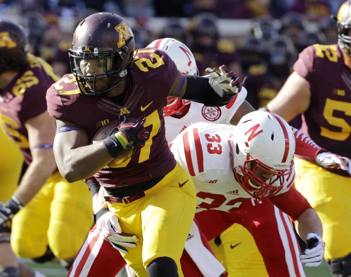 Minnesota running back David Cobb picks up seven yards on a first-quarter carry during the Gophers' upset win over Nebraska on Saturday.