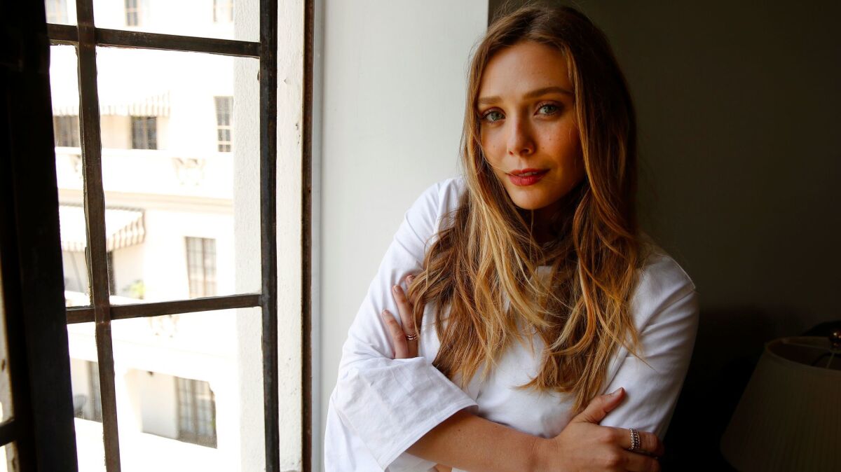 Olsen looks out at the view from Room 64 at the Chateau Marmont.
