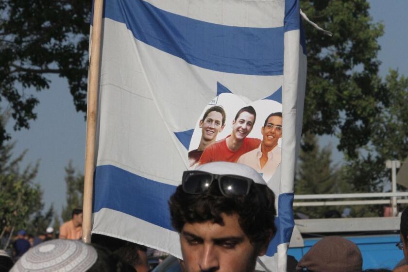 Tens of thousands attended the joint funeral of three Israeli teenagers who were kidnapped in the West Bank last month and whose bodies were found on June 30.