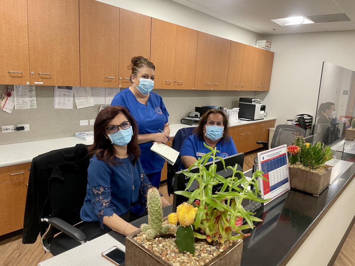 Operations Director Izabella Sahakian, left, pictured with staff.