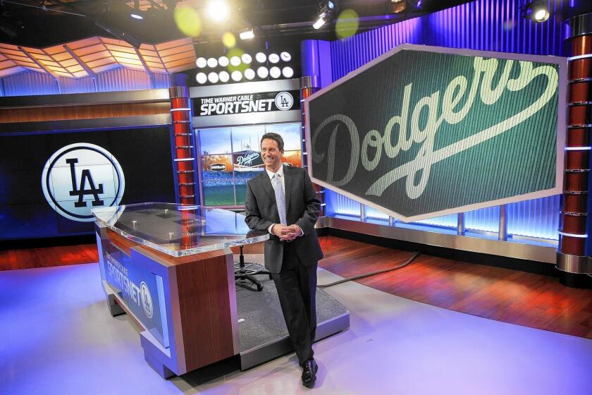 John Hartung will be the main studio anchor for SportsNet LA, a new channel launching as the TV home of the Los Angeles Dodgers. Hartung is shown at Time Warner Cable Sports Networks studio in El Segundo.