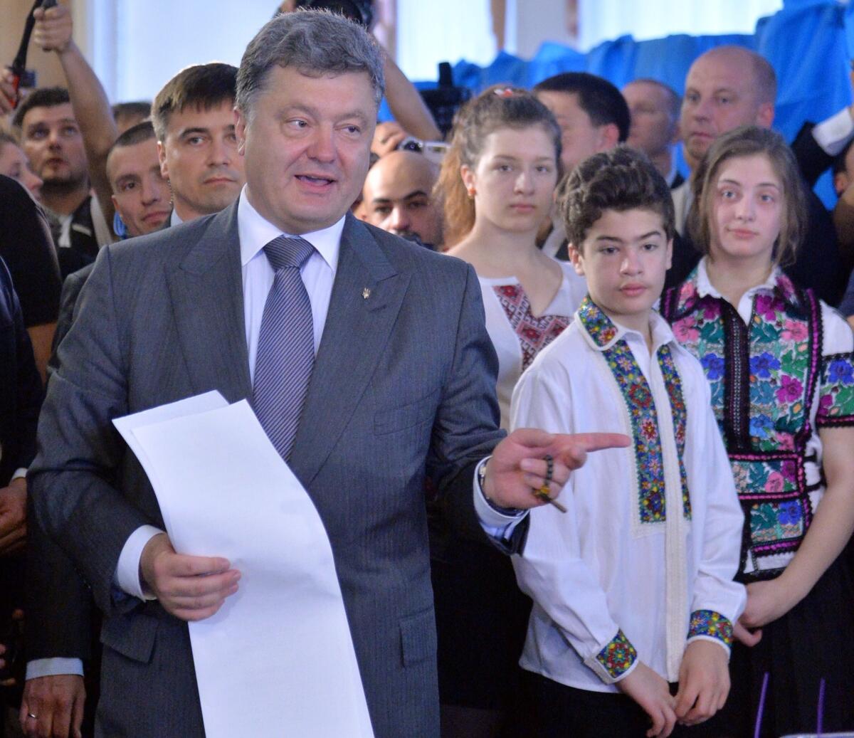 Ukrainian presidential candidate Petro Poroshenko casting his ballot in Kiev on Sunday. Exit polls indicate he won an outright majority of votes, which would allow him to avoid a runoff.