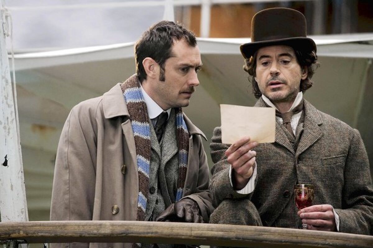 Jude Law, left, as Dr. Watson, and Robert Downey Jr. as the eponymous detective in "Sherlock Holmes: A Game of Shadows."