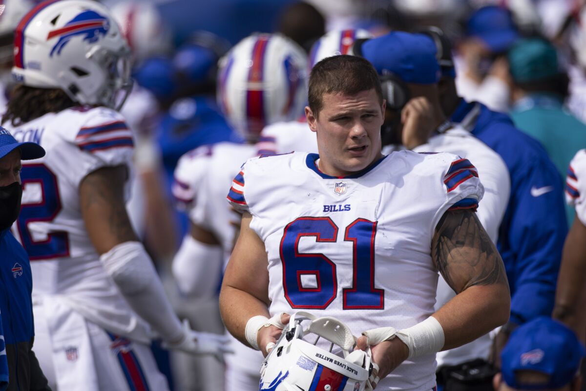 Buffalo Bills defensive tackle Justin Zimmer (61) walks on the sideline during an NFL football game against the New York Jets, Sunday, Sept. 13, 2020, in Orchard Park, N.Y. Justin Zimmer had more appearances on the NFL transactions list than tackles -- 27-15 -- since 2016, when the undersized defensive lineman first broke into the NFL as an undrafted free agent with the Buffalo Bills. None of that mattered on Sunday, Nov. 1, 2020, when Zimmer, in his second stint with Buffalo will be remembered for forcing the decisive fumble to secure a 24-21 win over the Bills AFC arch-nemesis New England Patriots. (AP Photo/Brett Carlsen, Fikle)