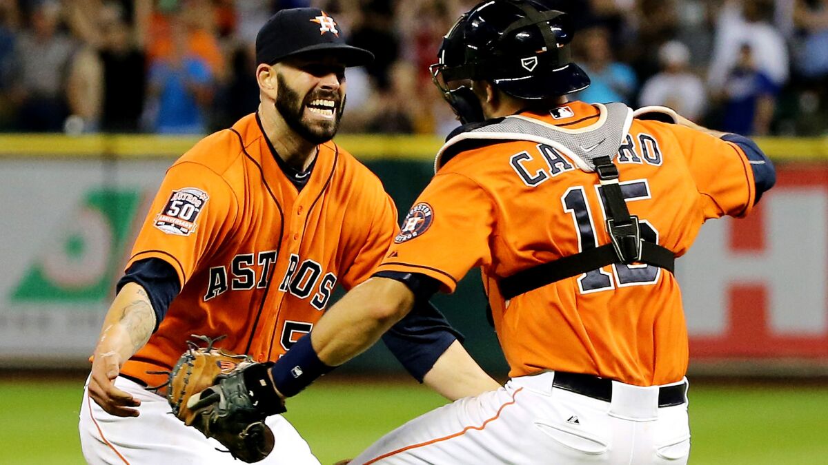 Houston Astros starting pitcher Mike Fiers celebrates with catcher Jason Castro after throwing a no-hitter against the Dodgers.