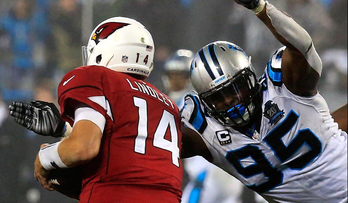 Cardinals quarterback Ryan Lindley gets sacked by Panthers defensive lineman Charles Johnson during their NFC wild-card playoff game on Saturday in Charlotte, N.C.