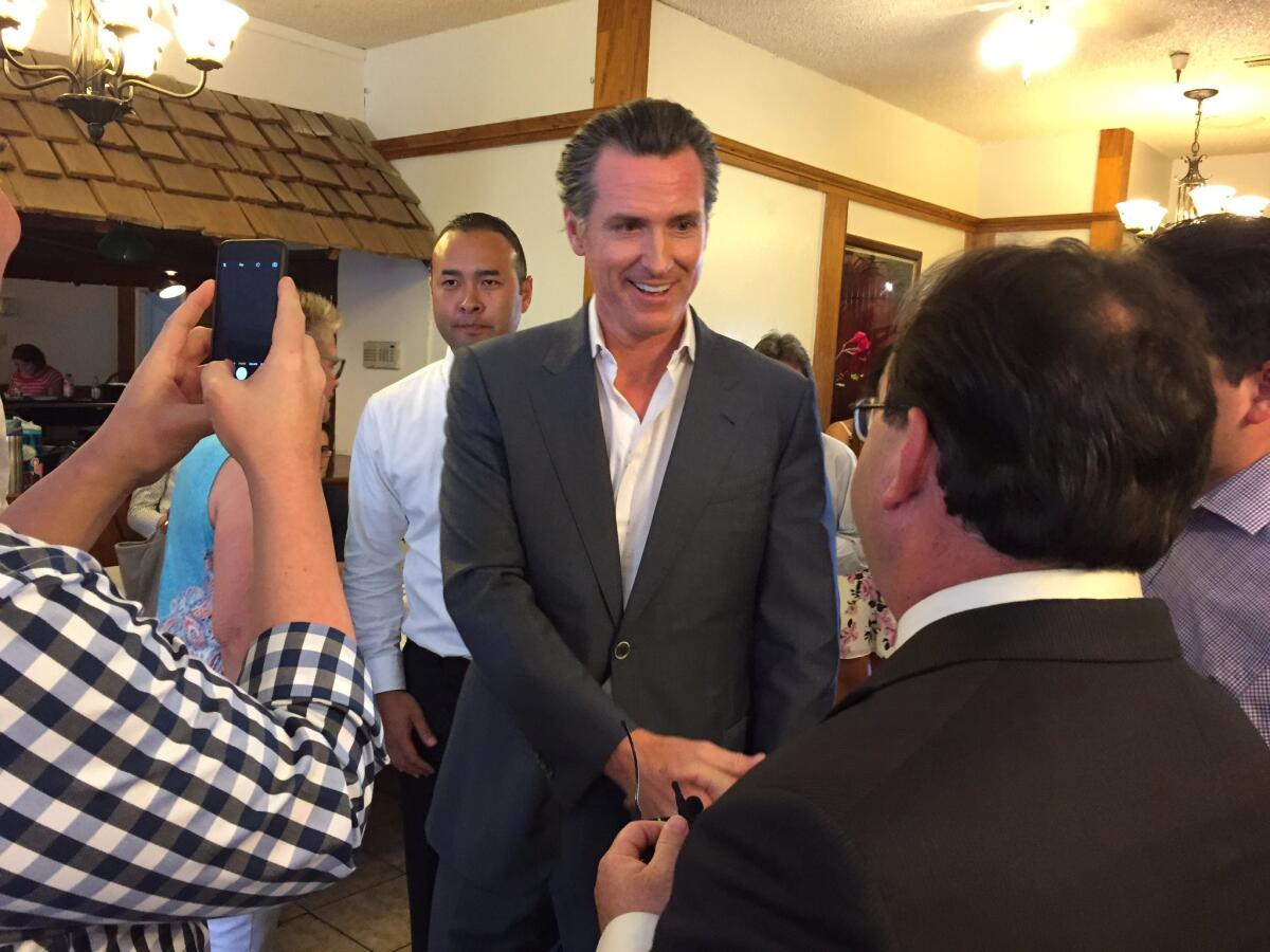 Lt. Gov. Gavin Newsom holds a meet-and-greet at Tuolumne Hall in Fresno on Tuesday as he campaigns for governor across the Central Valley.