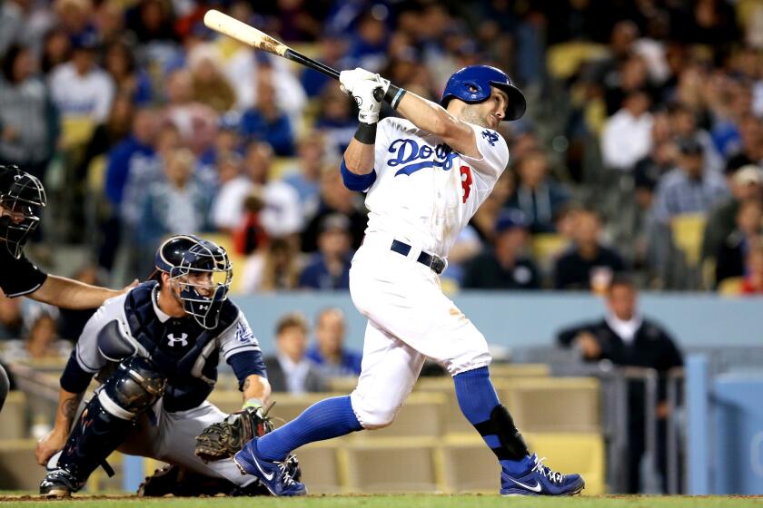 Dodgers' Skip Schumaker hits a double against the San Diego Padres at Dodger Stadium.