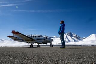 Thomas Painter stands on the tarmac at Mammoth-Yosemite Airport.