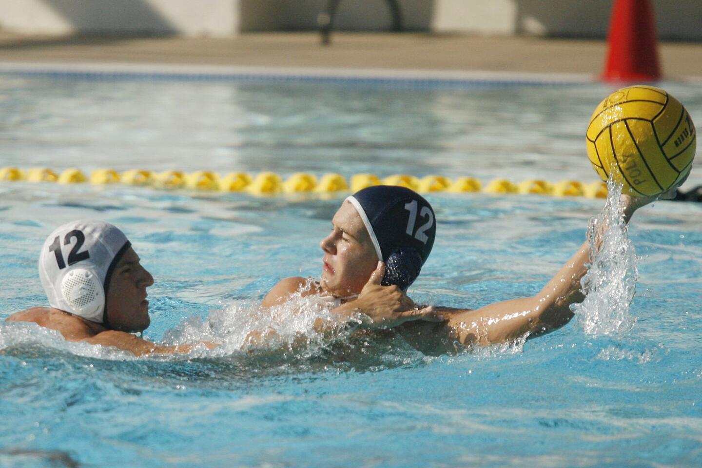 CV's Antonio Camarillo, left, blocks Pasadena Poly's Brock Hudnut during a match at Pasadena Poly on Tuesday, September 25. 2012.