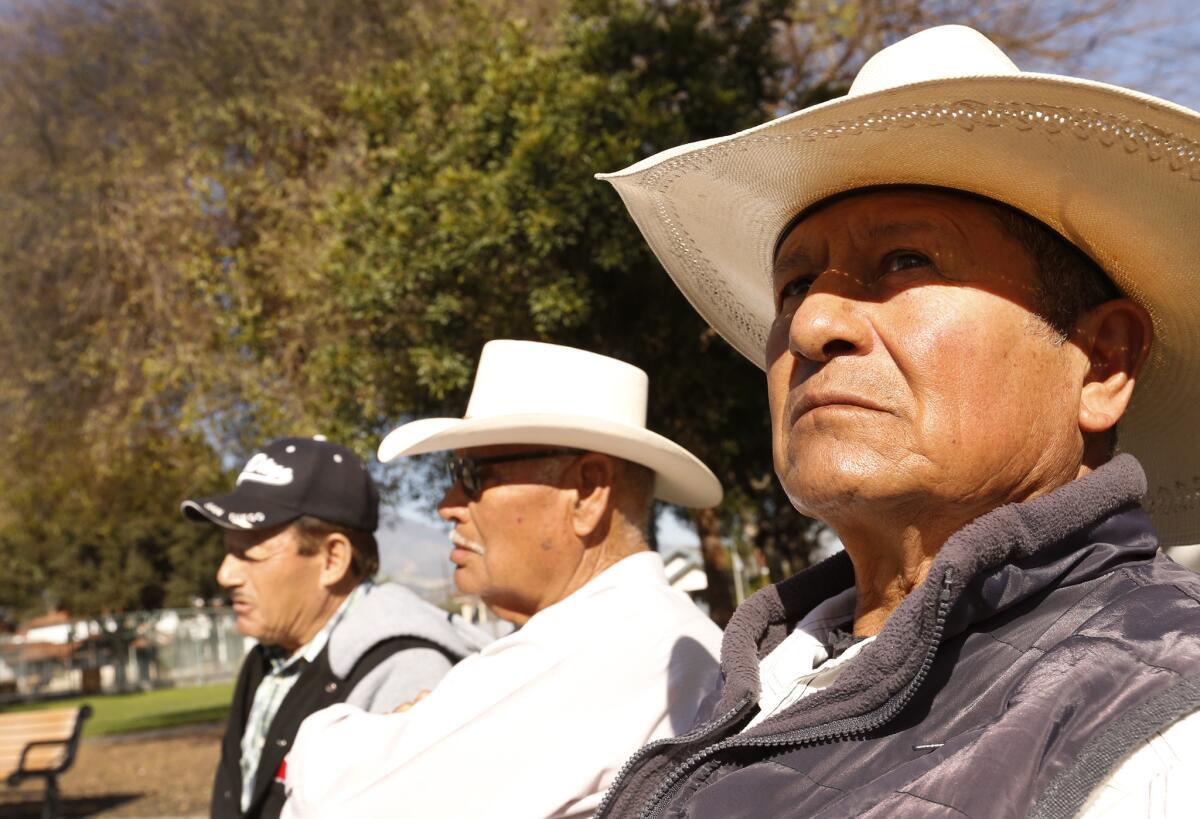 Jesus Rodriguez, right, joins friends in Veterans Memorial Park in Santa Paula on Feb. 14.