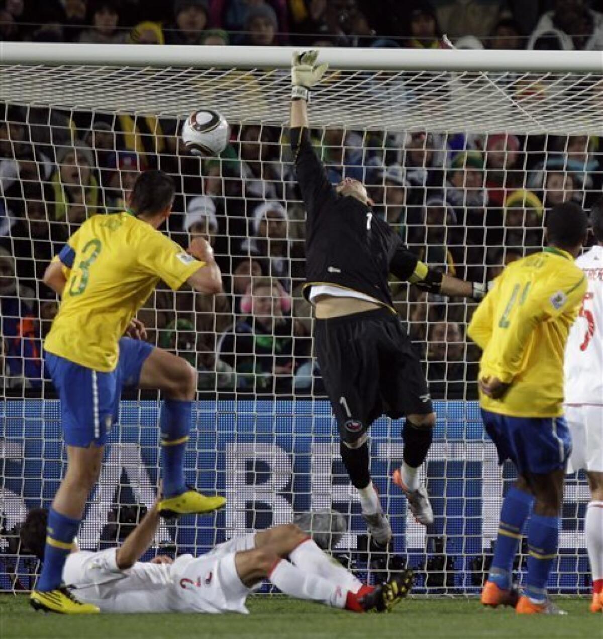 Brazil's Lucio and Robinho battles Chile's Humberto Suazo during the 2010  FIFA World Cup South Africa 1/8 of final Soccer match, Brazil vs Chile at  Ellis Park football stadium in Johannesburg, South