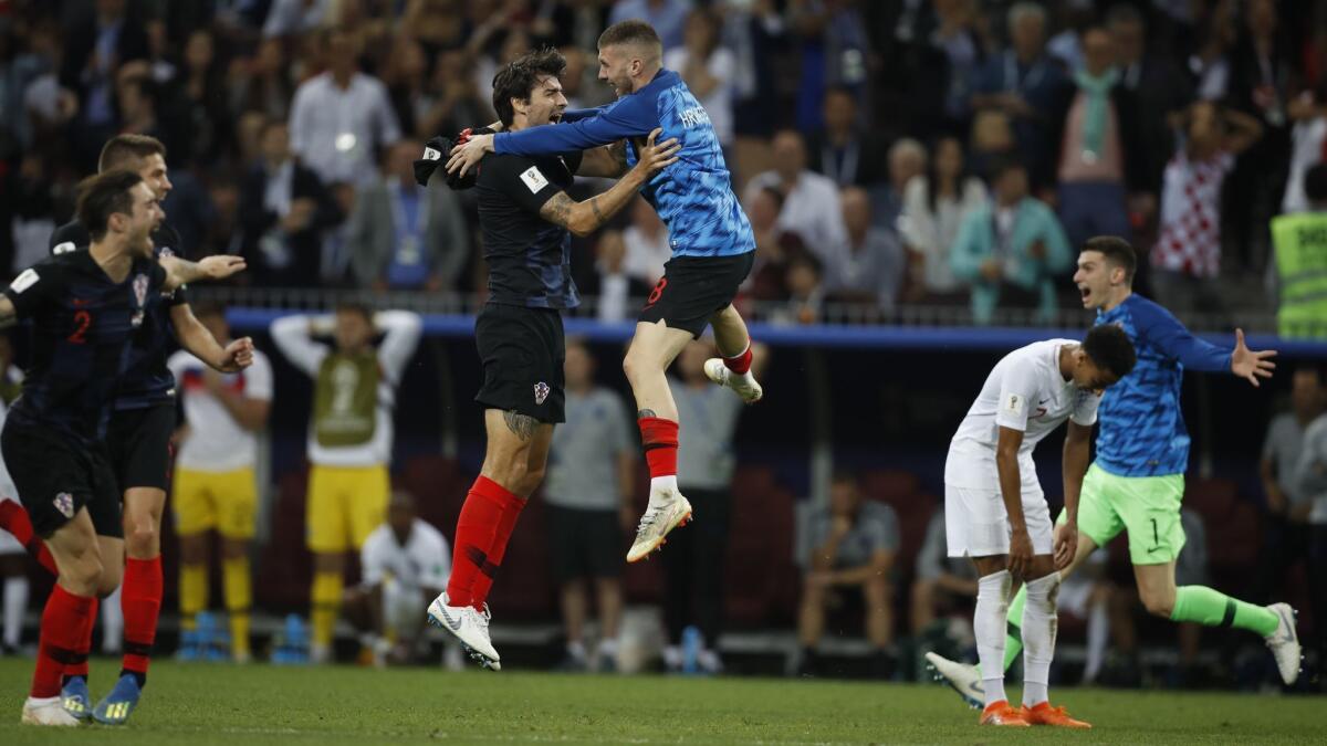 Croatian players celebrate after winning their semifinal match against England on July 11.