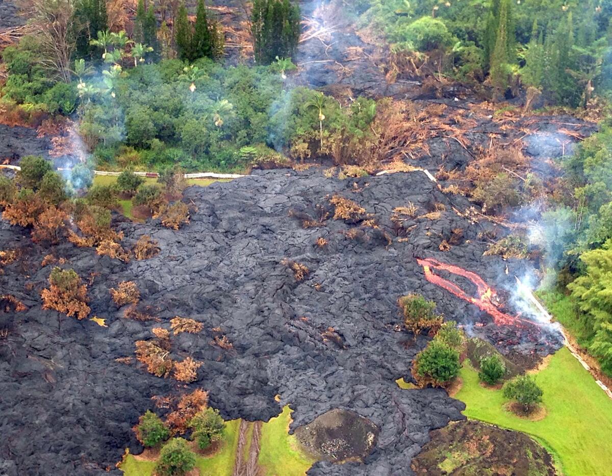 Lava from Kilauea, one of the most active volcanoes in the world, makes its way toward the eccentric town of Pahoa on the Big Island in November.