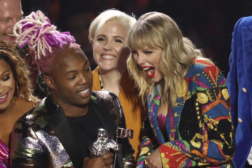 Taylor Swift, right, accepts the video for good award for "You Need to Calm Down" at the MTV Video Music Awards at the Prudential Center on Monday, Aug. 26, 2019, in Newark, N.J. (Photo by Matt Sayles/Invision/AP)