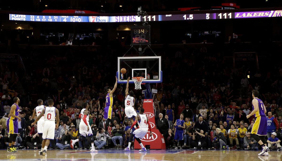 Lakers point guard Jordan Clarkson shoots the game-winning layup with less than a second remaining in overtime over 76ers point guard Ish Smith, who lost Clarkson defensively on the play.